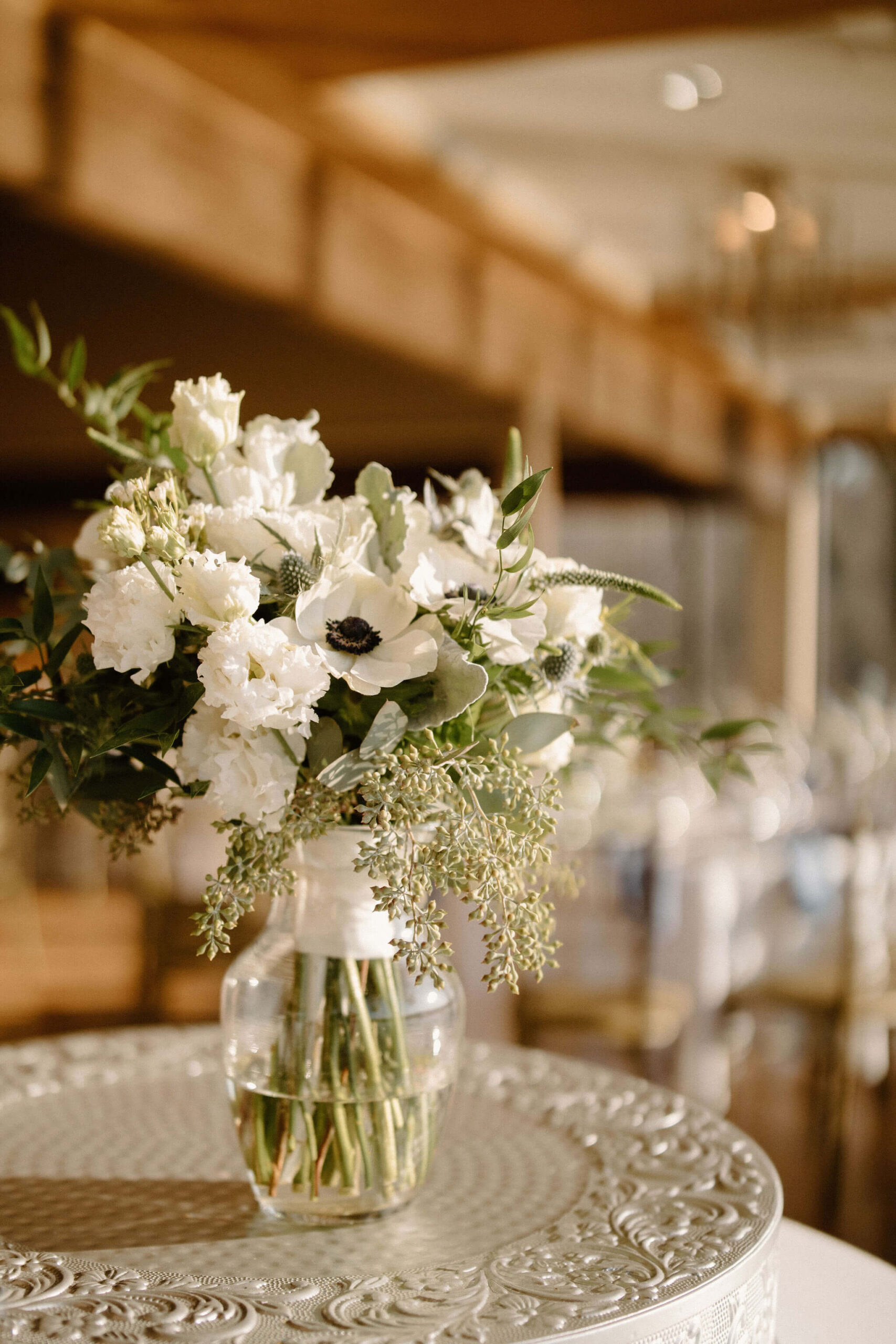 bridal bouquet with lots of greenery and eucalyptus, thistles, white roses, and white poppies in lambertville new jersey