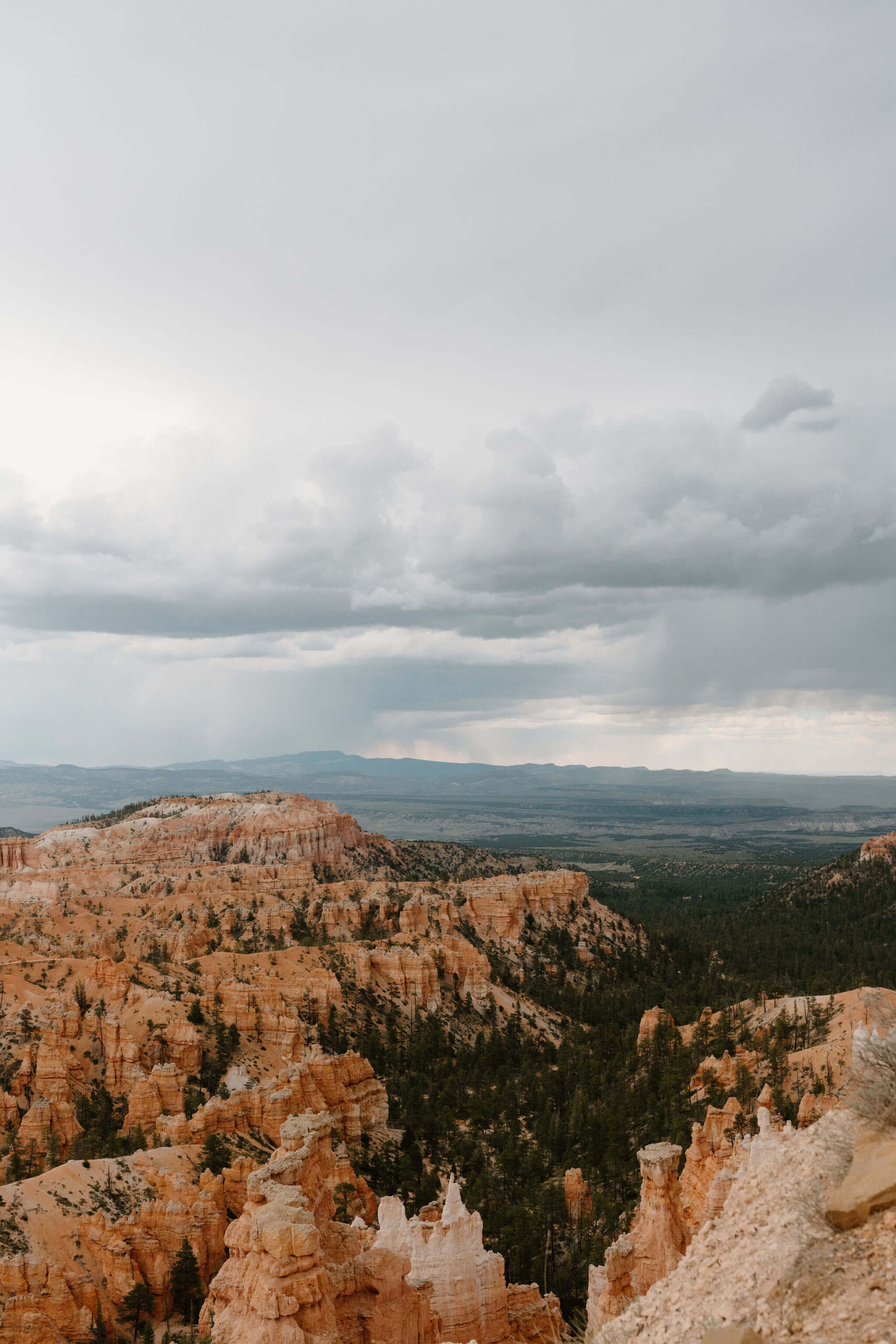 overlook of red-rock hoodoos and the desert landscape of Bryce Canyon National Park