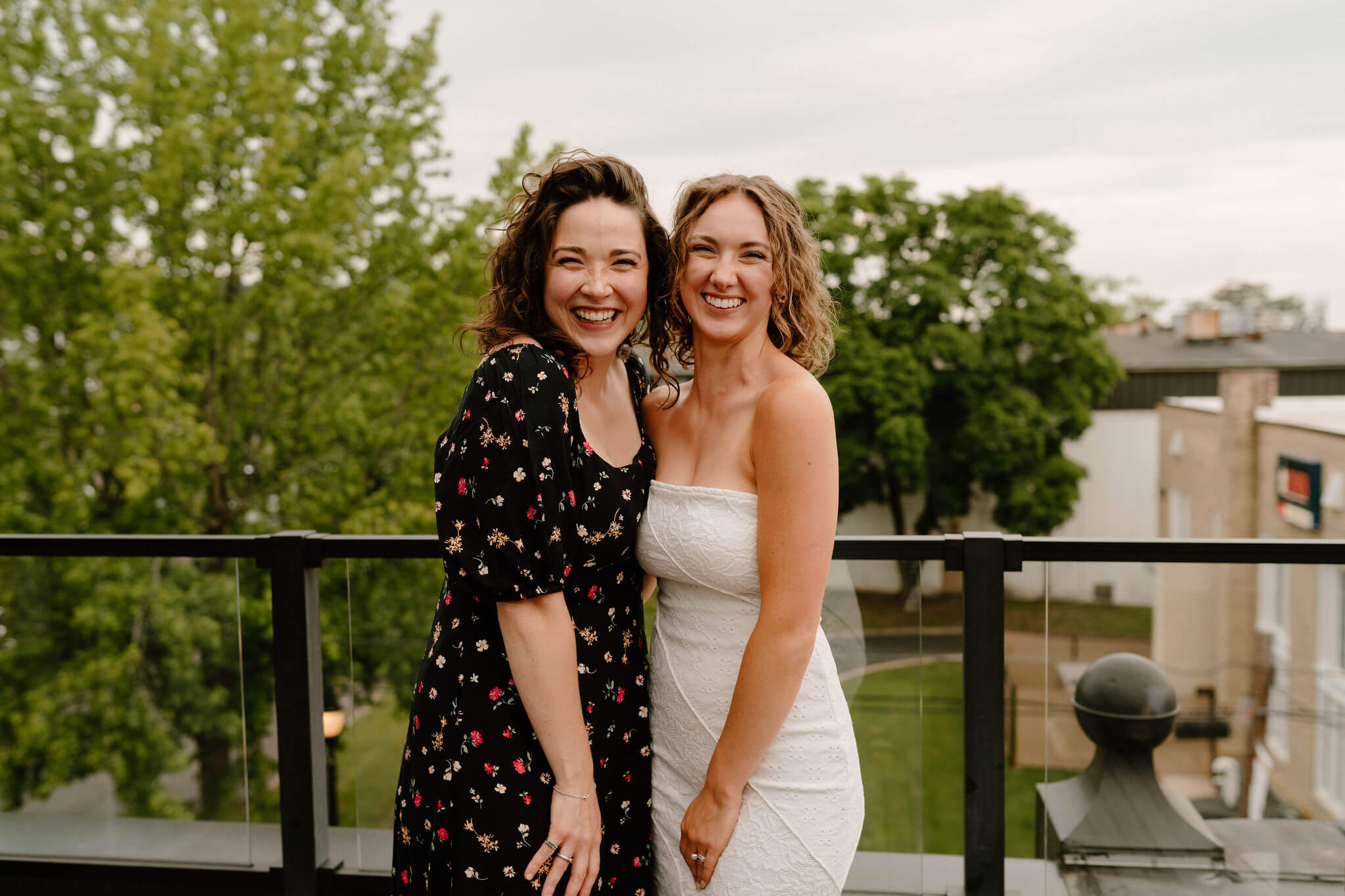 bride and her sister, smiling toward the camera