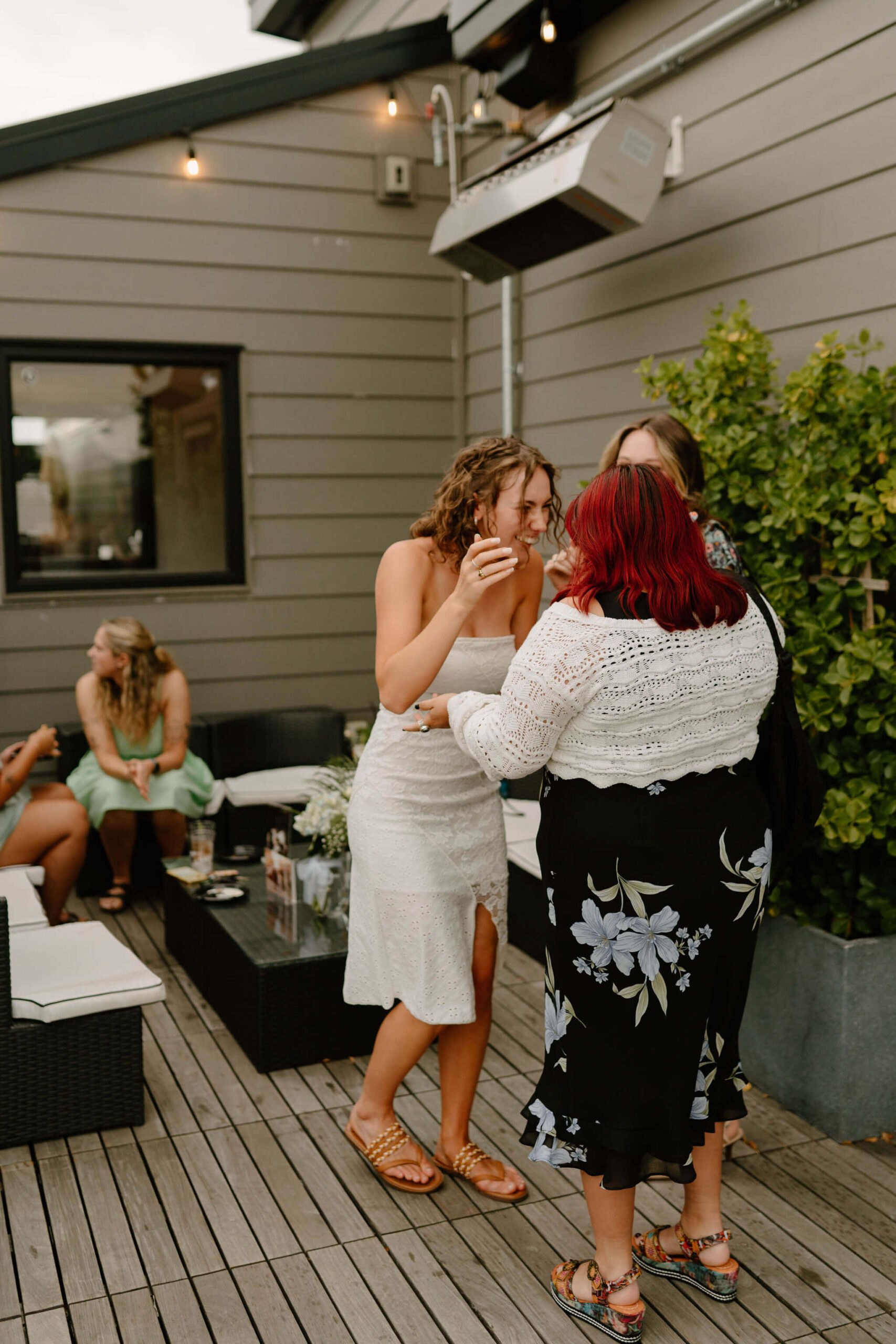 bride laughing and greeting guests