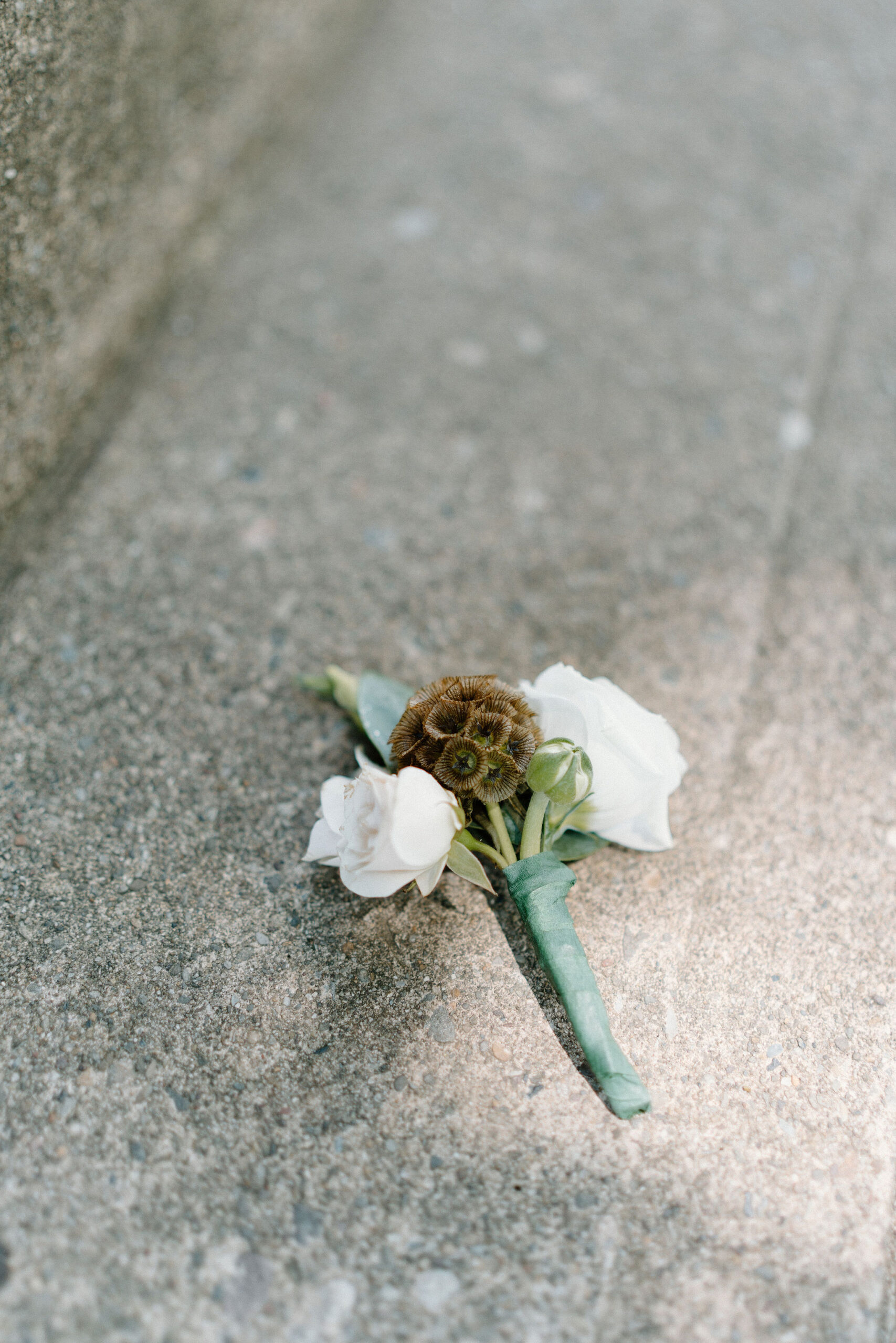 close up of a groom's boutonniere 