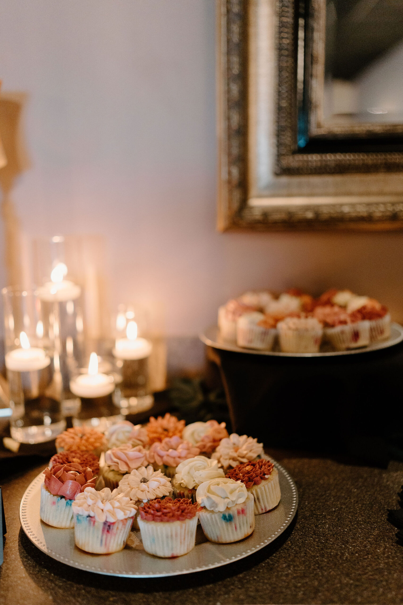 cupcakes decorated like pink and orange floweres