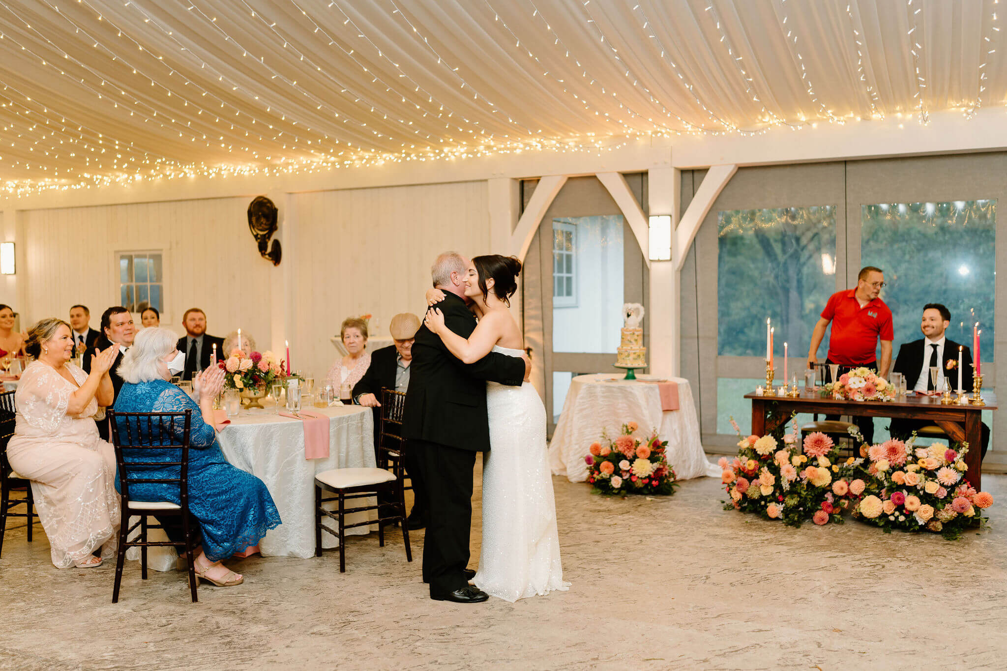 bride and her father embracing during their father/daughter dance at her wedding reception