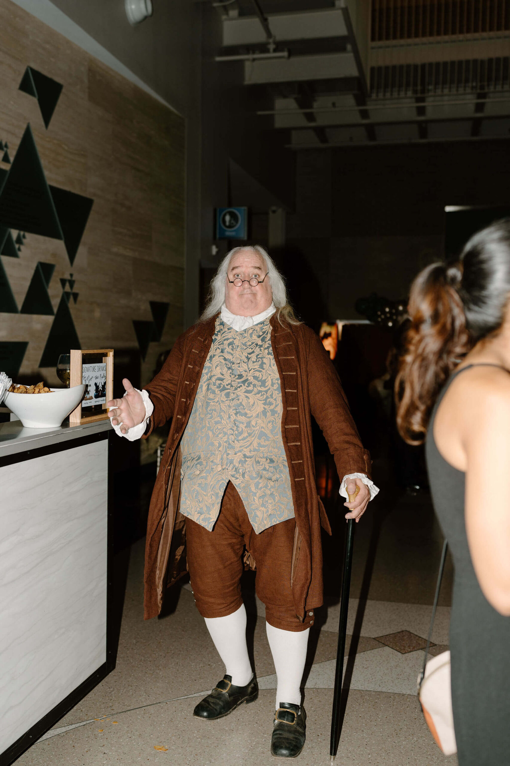 a benjamin franklin impersonator giving the camera a thumbs-up