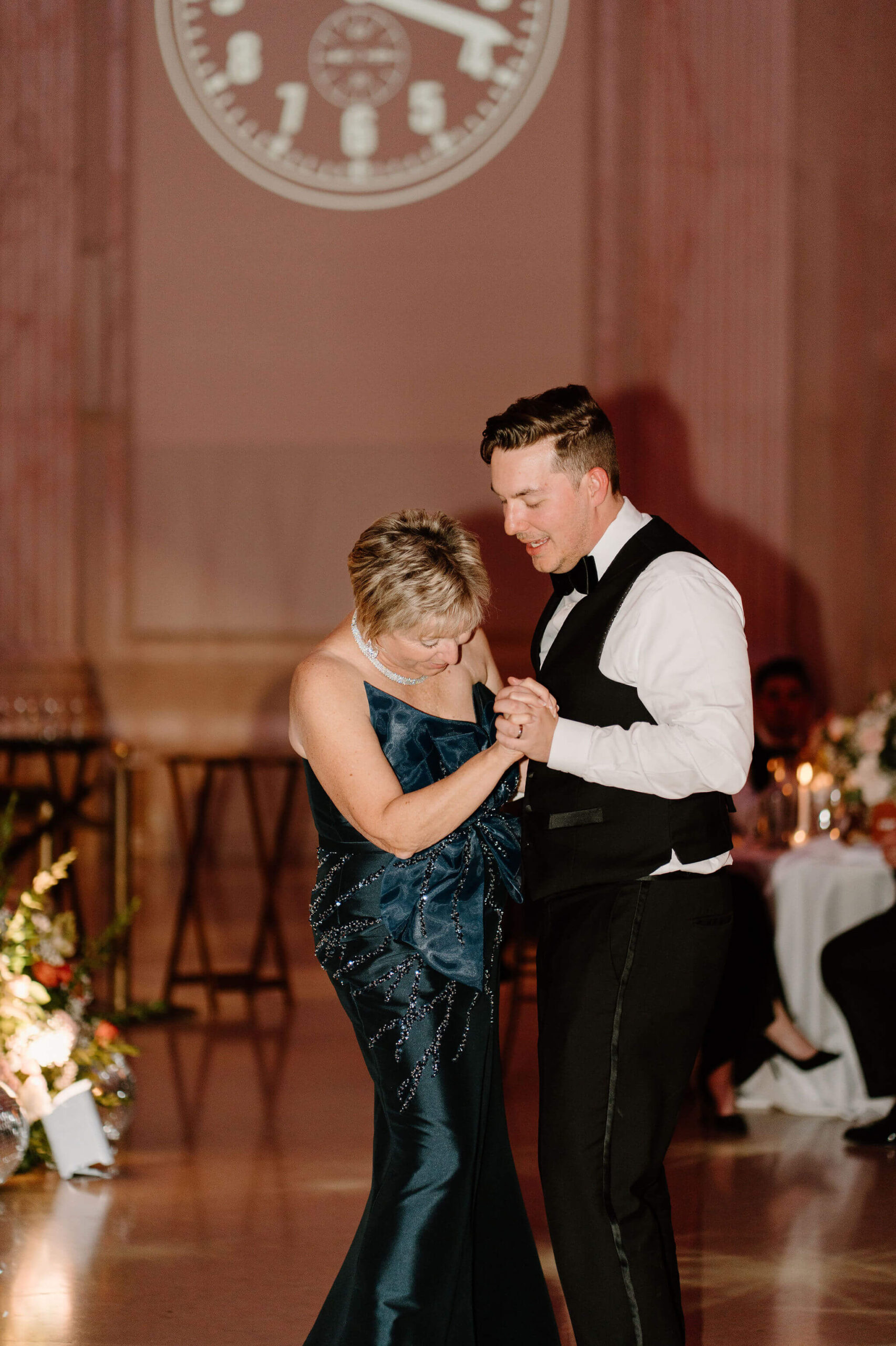 groom and his mother during their mother/son dance at a wedding reception