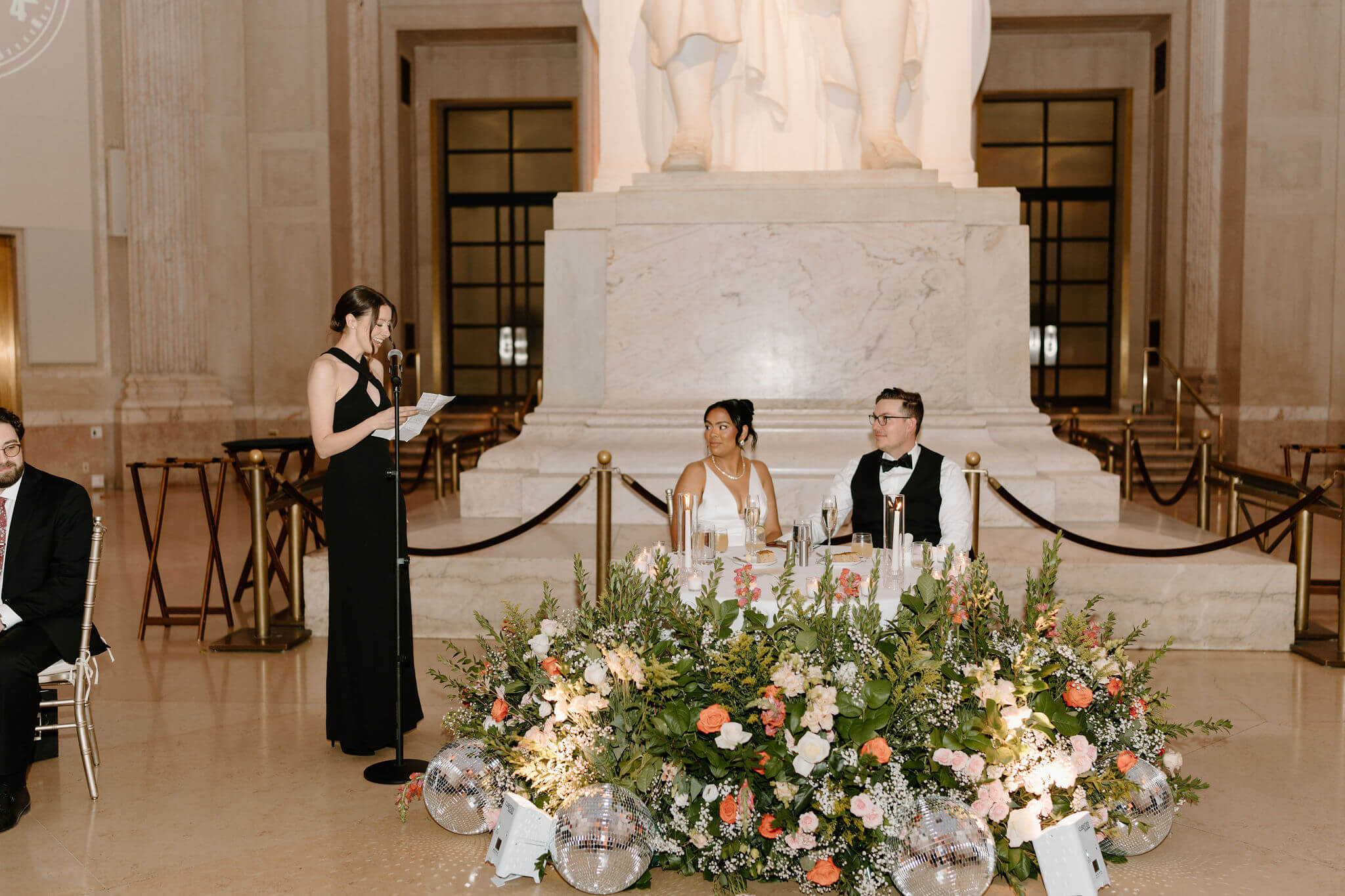 maid of honor giving a speech during a wedding reception