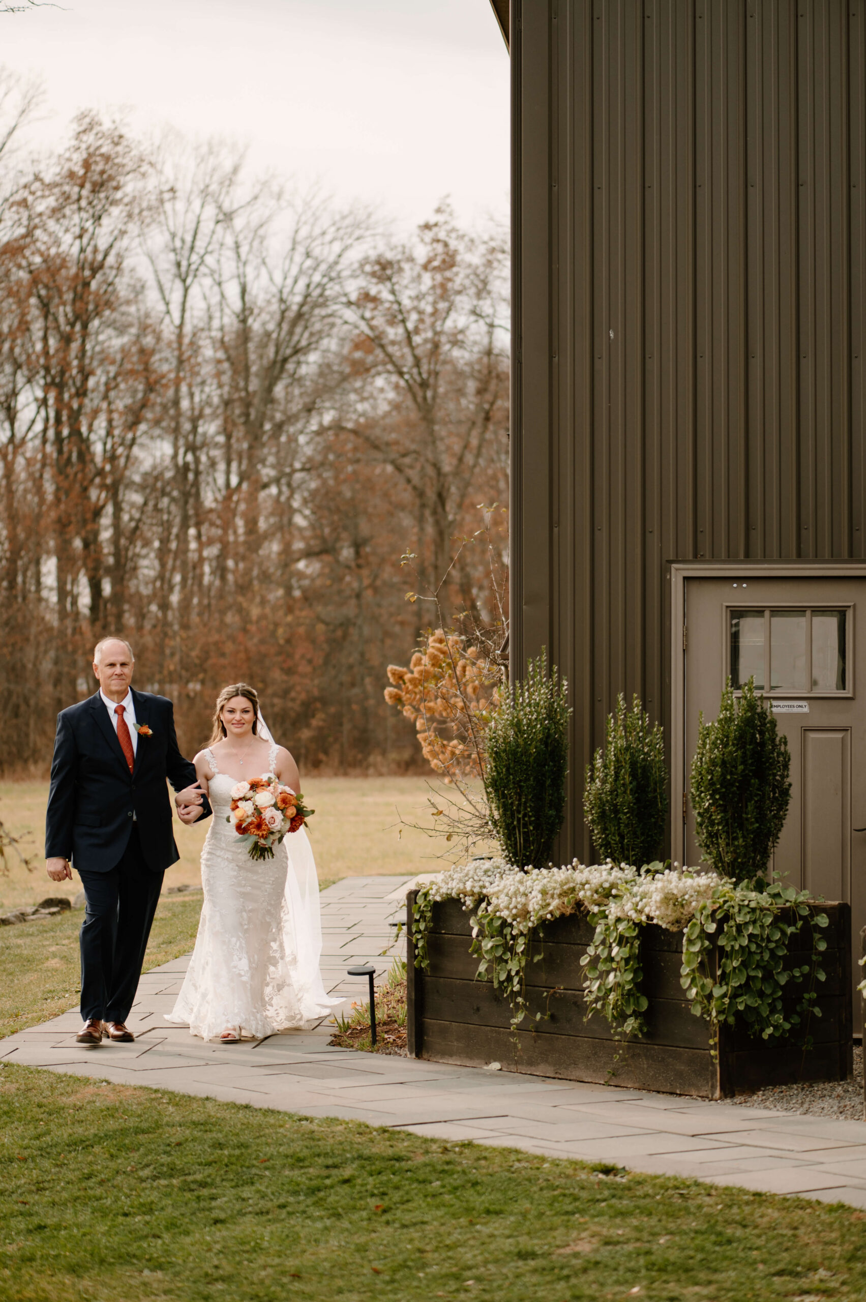 bride and her father walking down the aisle to her wedding ceremony