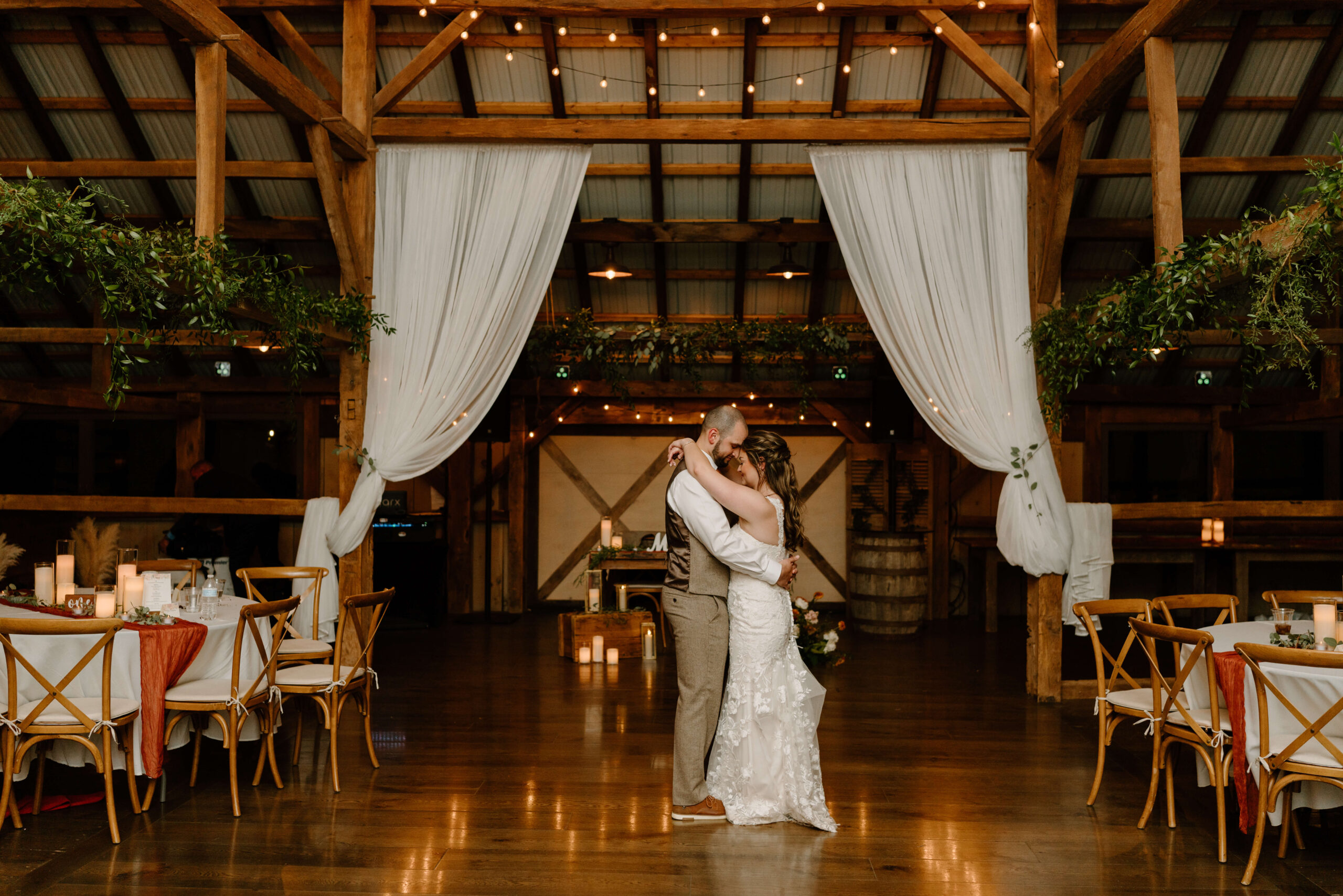 bride and groom sharing a private last slow-dance after their reception on their November wedding day at the rustic Farm Bakery and Events
